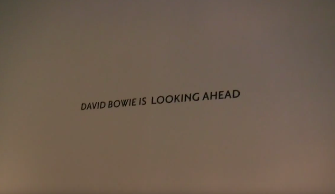 Watch: Dean Holtermann Remembers David Bowie With Footage Of Mick Rock’s Bowie Exhibition