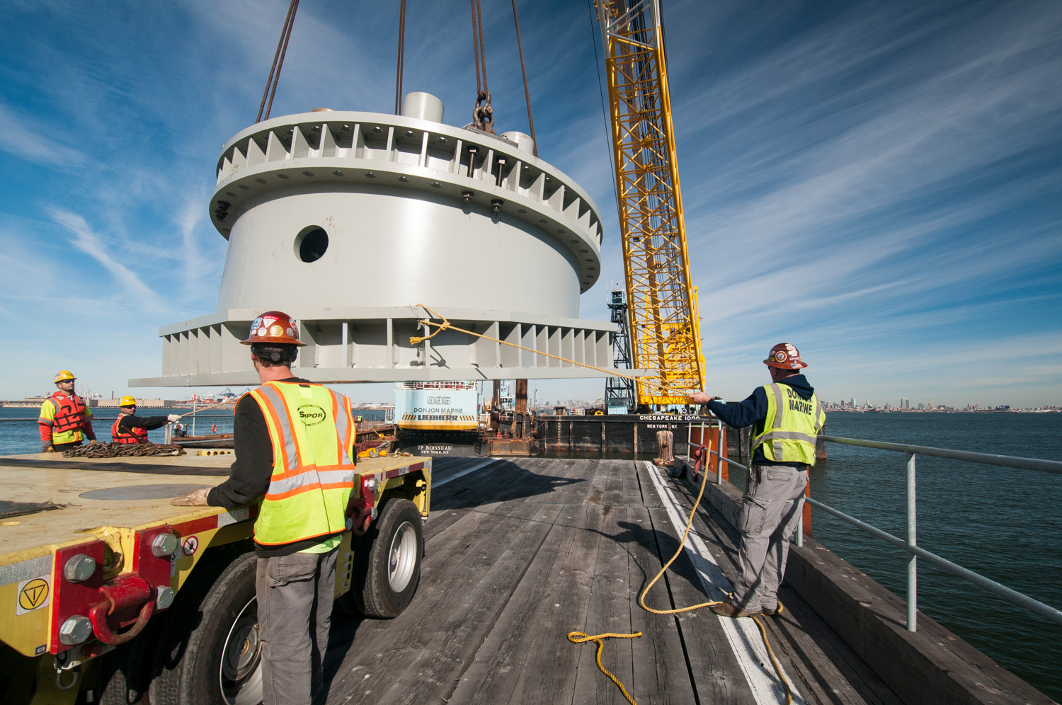 ny-wheel-pedestalbein-loaded-onto-transporter-by-workers-0145